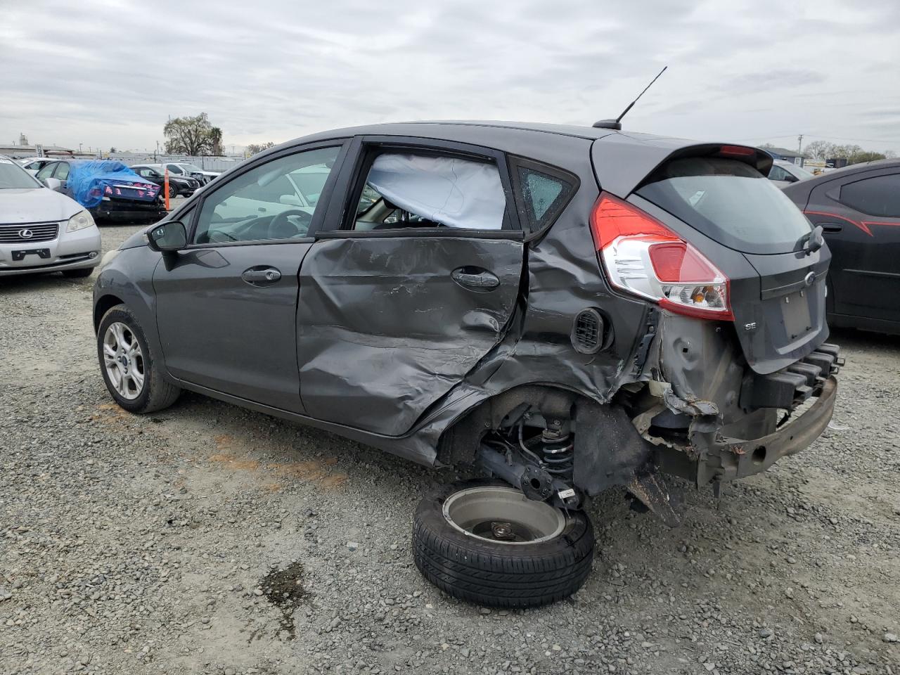 2016 Ford Fiesta VIN 3FADP4EJ9GM147615 Copart auction photo, side / rear end damage thumbnail 2