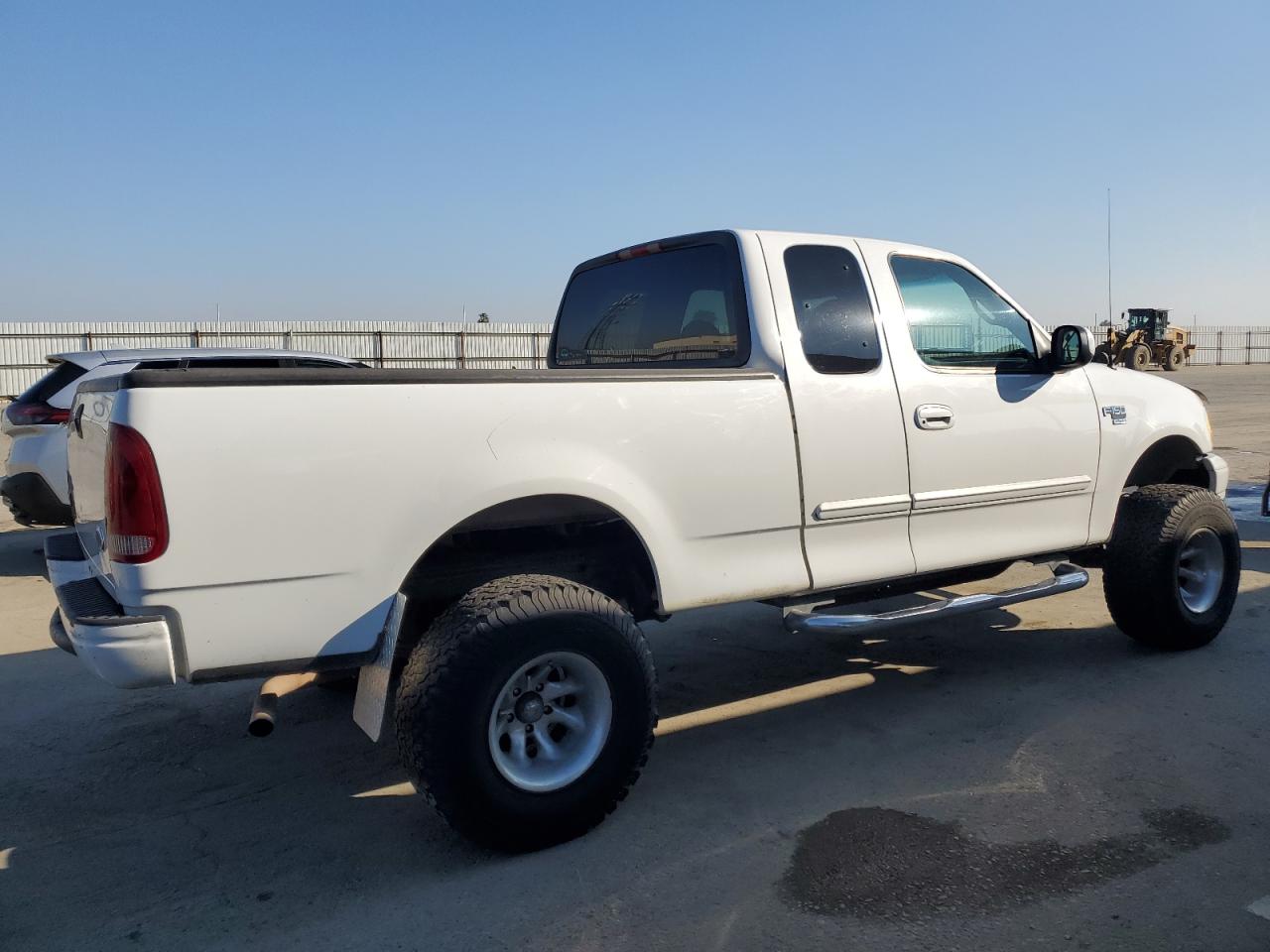 1999 Ford F-150 VIN 1FTRX17W5XKC25452 Copart auction photo, rear end damage thumbnail 3