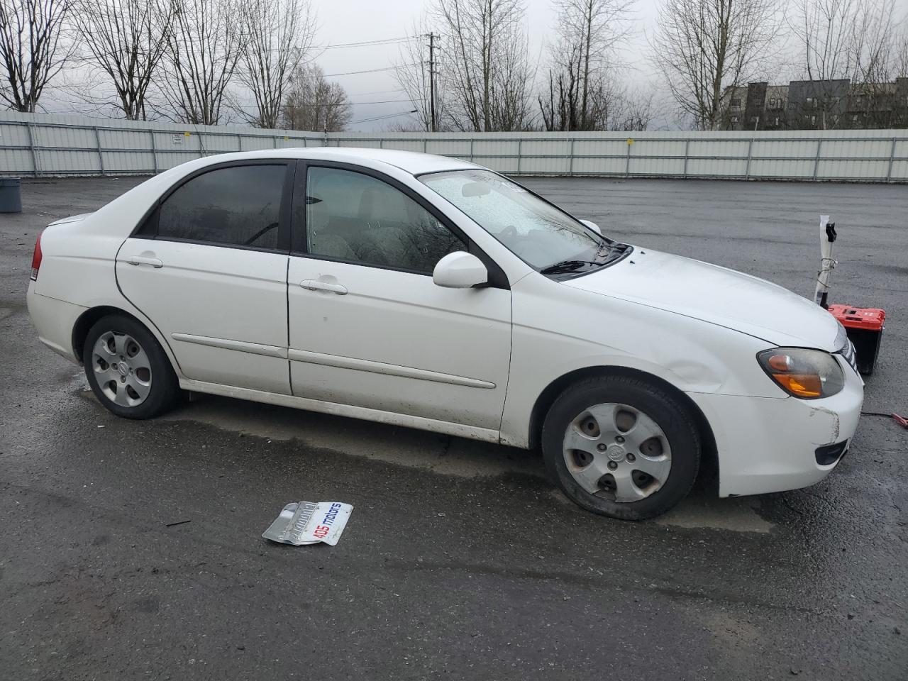 2009 KIA Spectra VIN KNAFE222X95661649 Copart auction photo, side / front end damage thumbnail 4