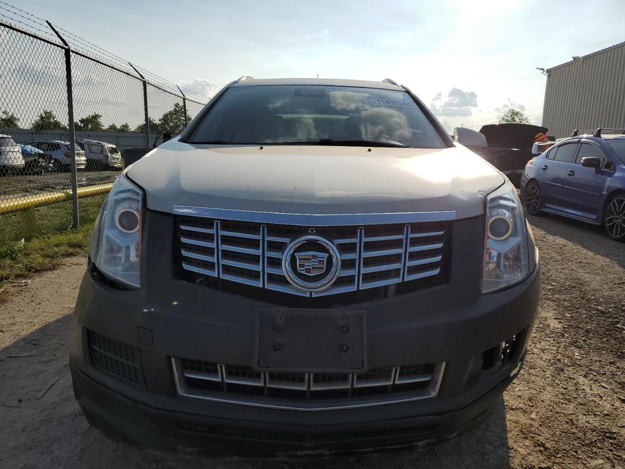 2013 Cadillac SRX VIN 3GYFNCE32DS535792 Copart auction photo, front end damage thumbnail 5