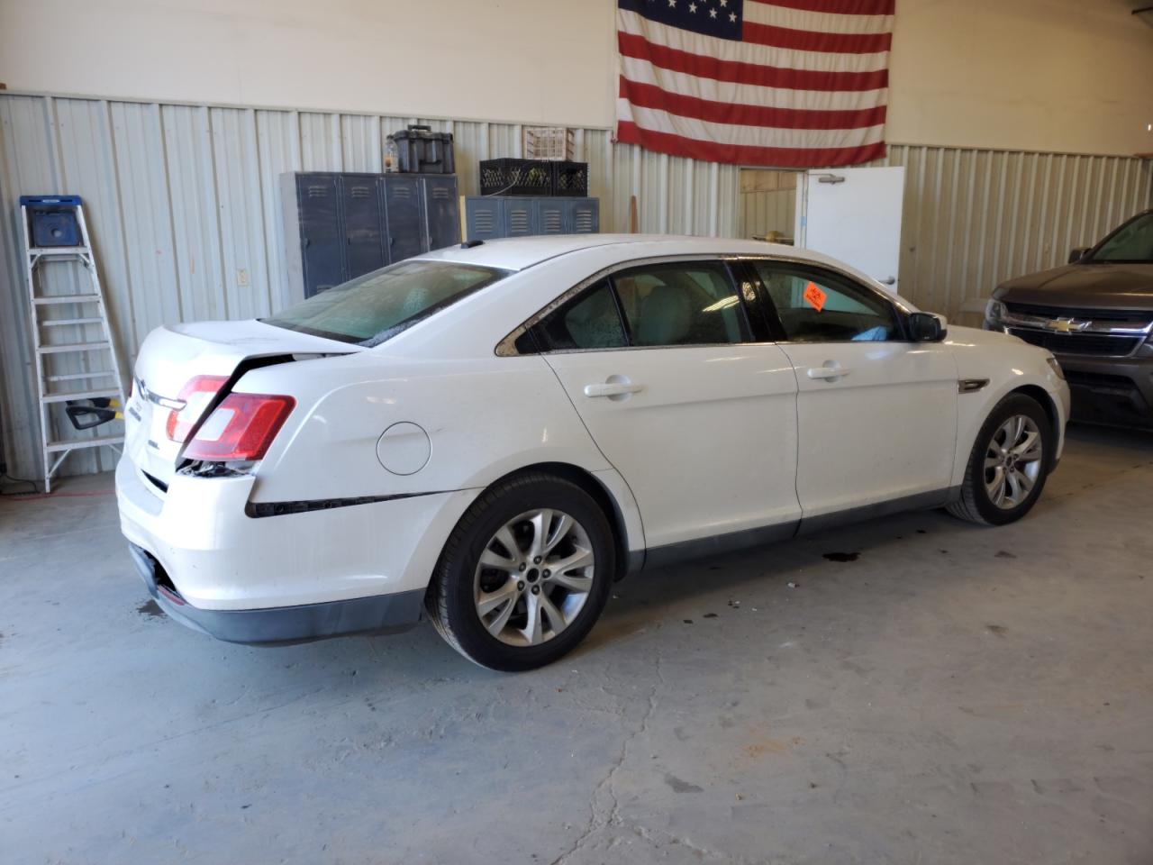 2011 Ford Taurus VIN 1FAHP2EWXBG119312 Copart auction photo, rear end / side damage thumbnail 3