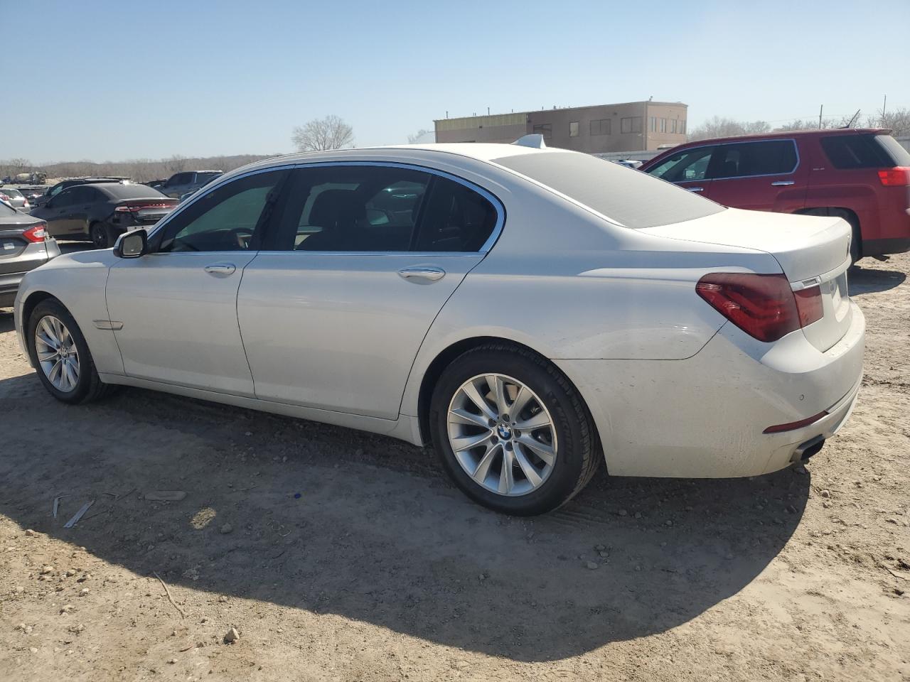 2015 BMW 7er VIN WBAYE4C54FD947298 Copart auction photo, side / front end damage thumbnail 2