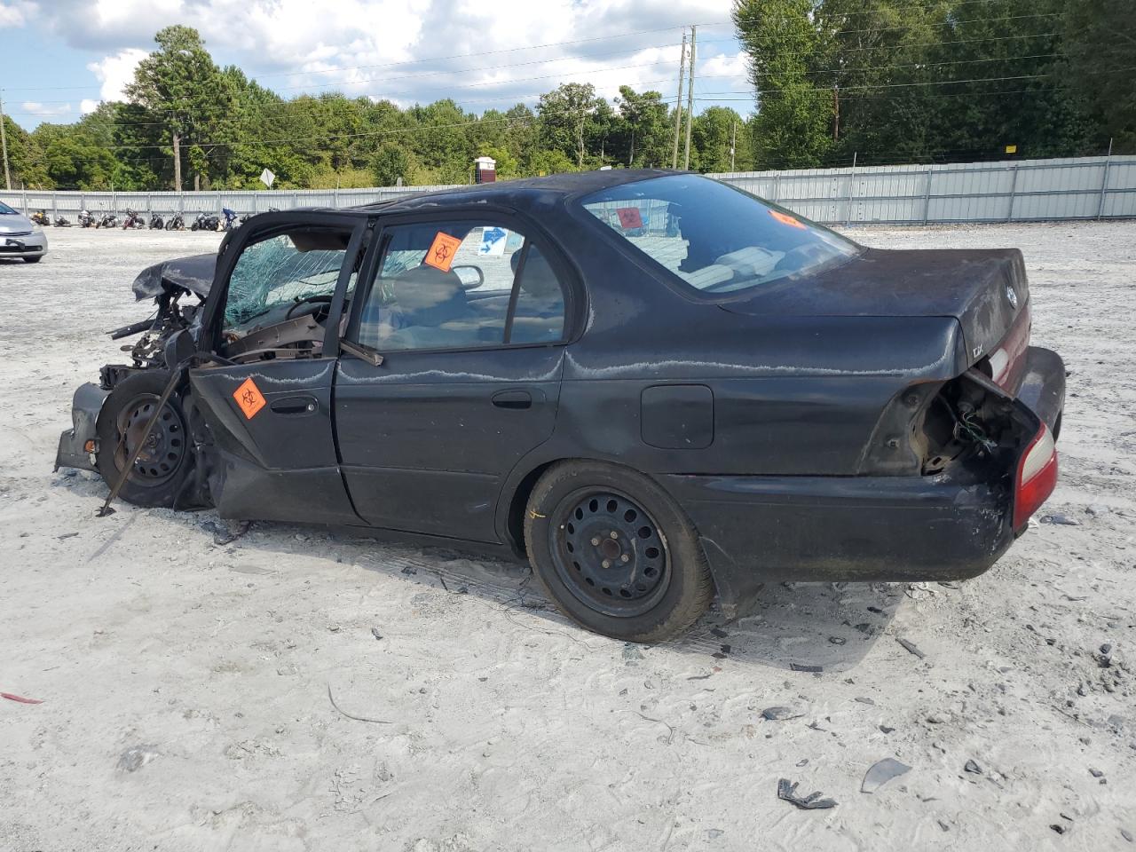 1997 Toyota Corolla VIN 1NXBB02E9VZ663736 Copart auction photo, all over damage thumbnail 2