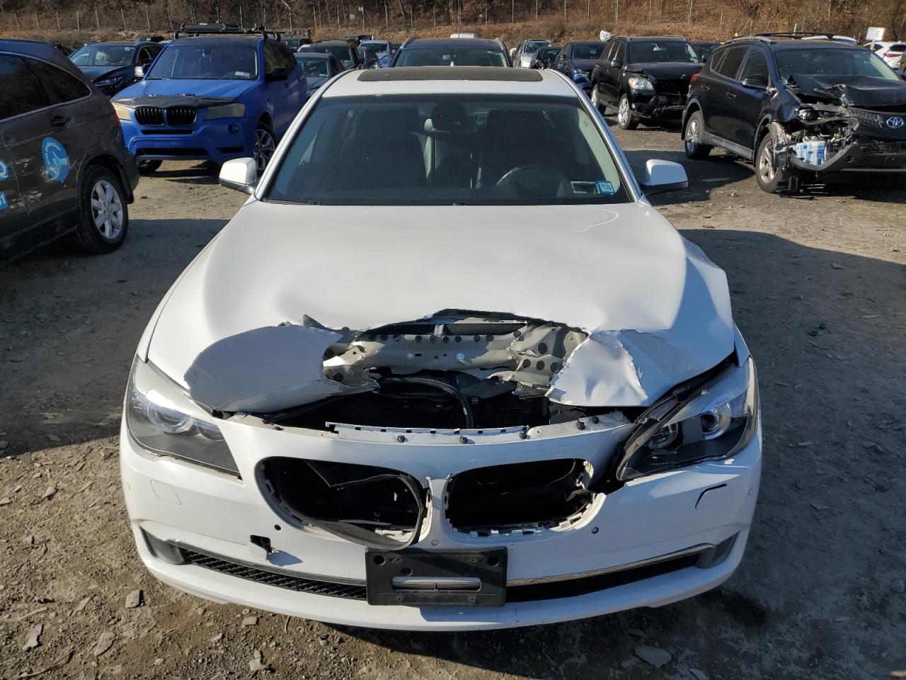 2012 BMW 7er VIN WBAKC6C59CDX99412 Copart auction photo, front end / minor dent/scratches damage thumbnail 5
