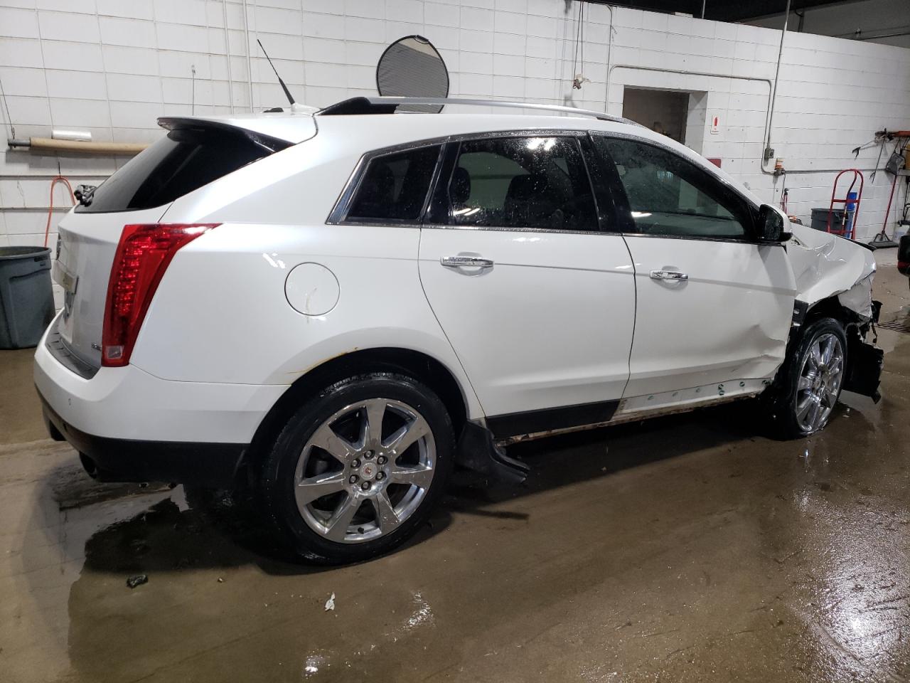 2012 Cadillac SRX VIN 3GYFNEE38CS657499 Copart auction photo, front end / side damage thumbnail 3