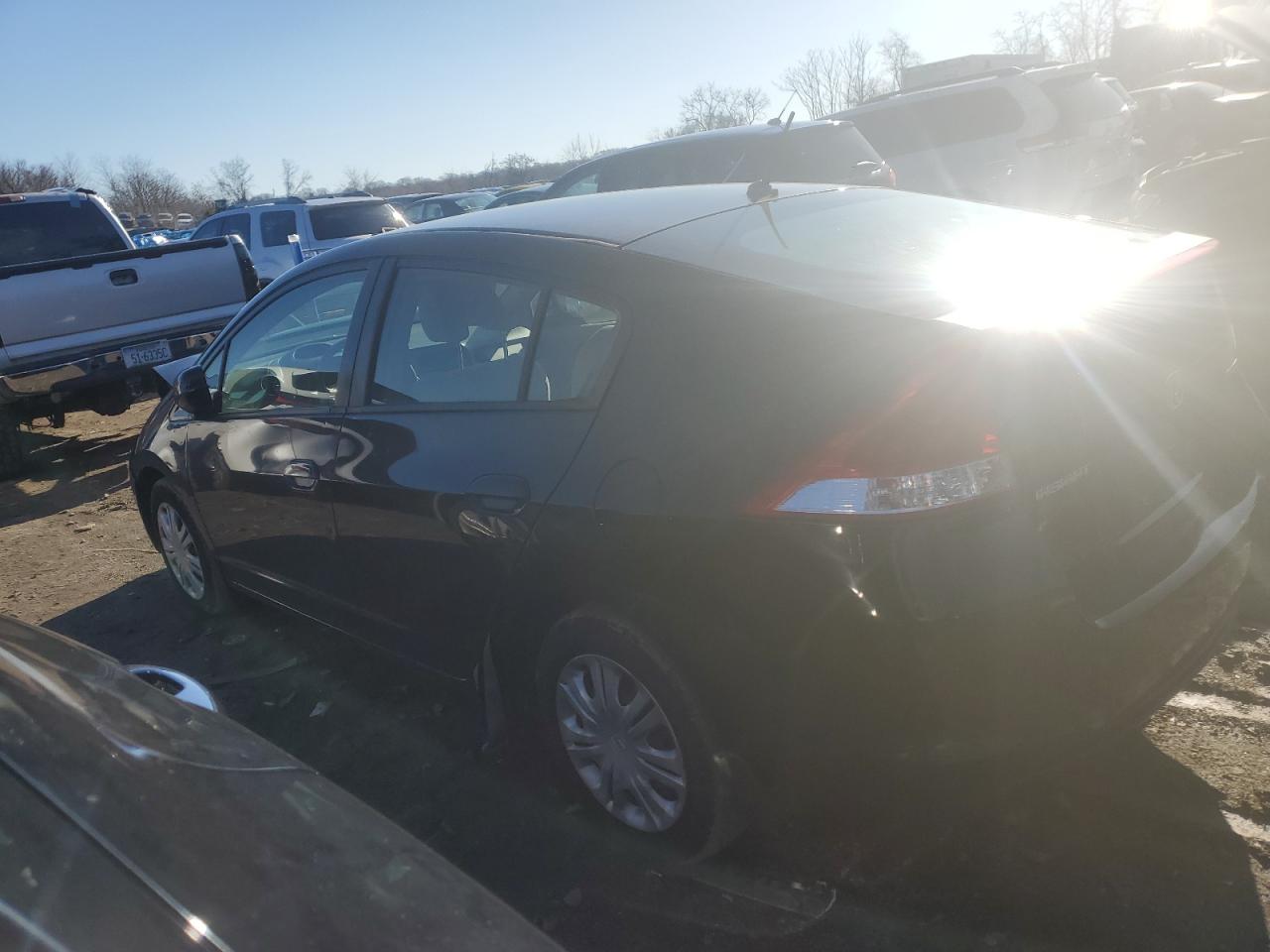 2010 Honda Insight VIN JHMZE2H51AS022288 Copart auction photo, front end / minor dent/scratches damage thumbnail 2