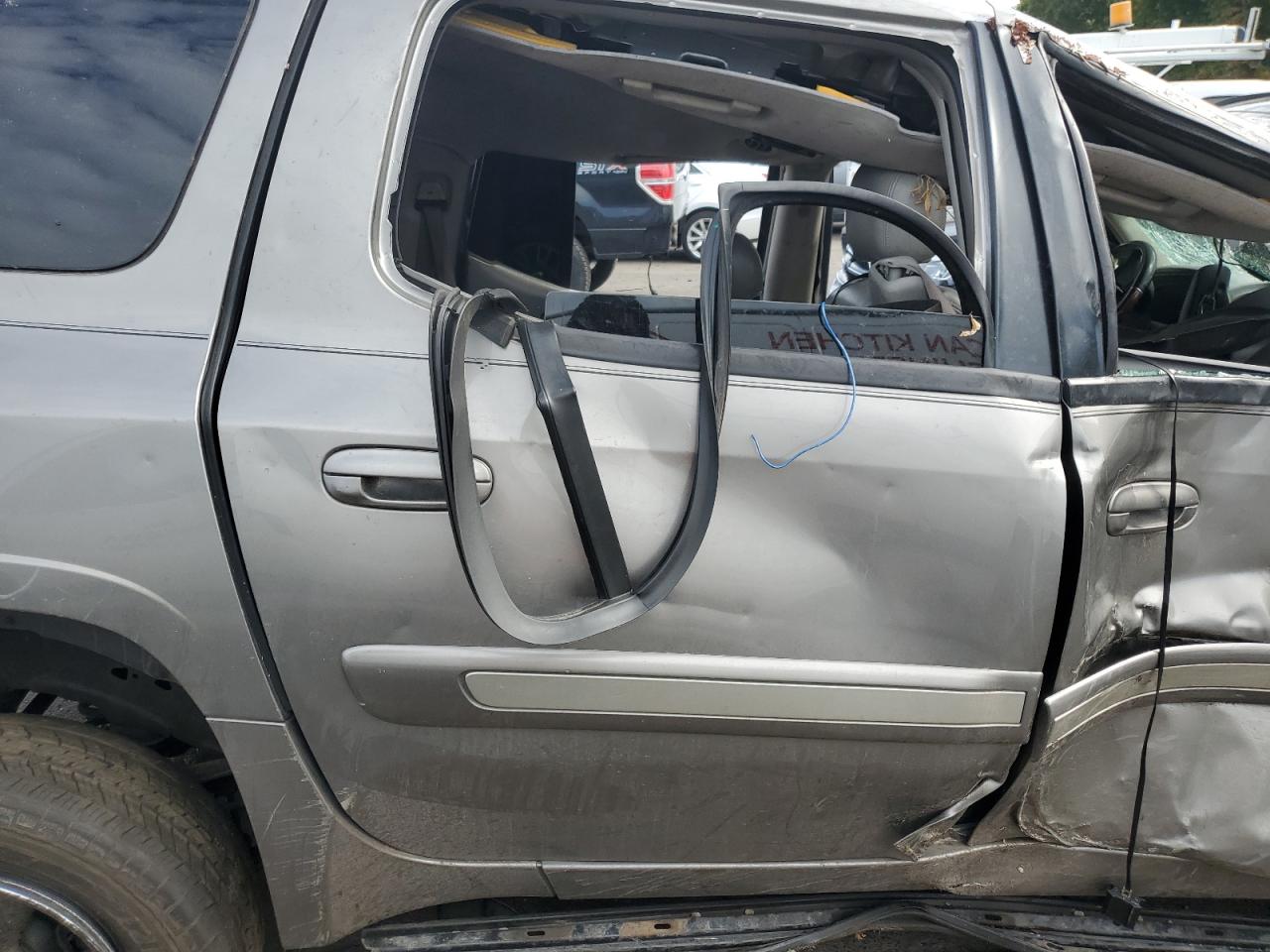 2005 GMC Envoy VIN 1GKET16S156152115 Copart auction photo, all over damage thumbnail 11