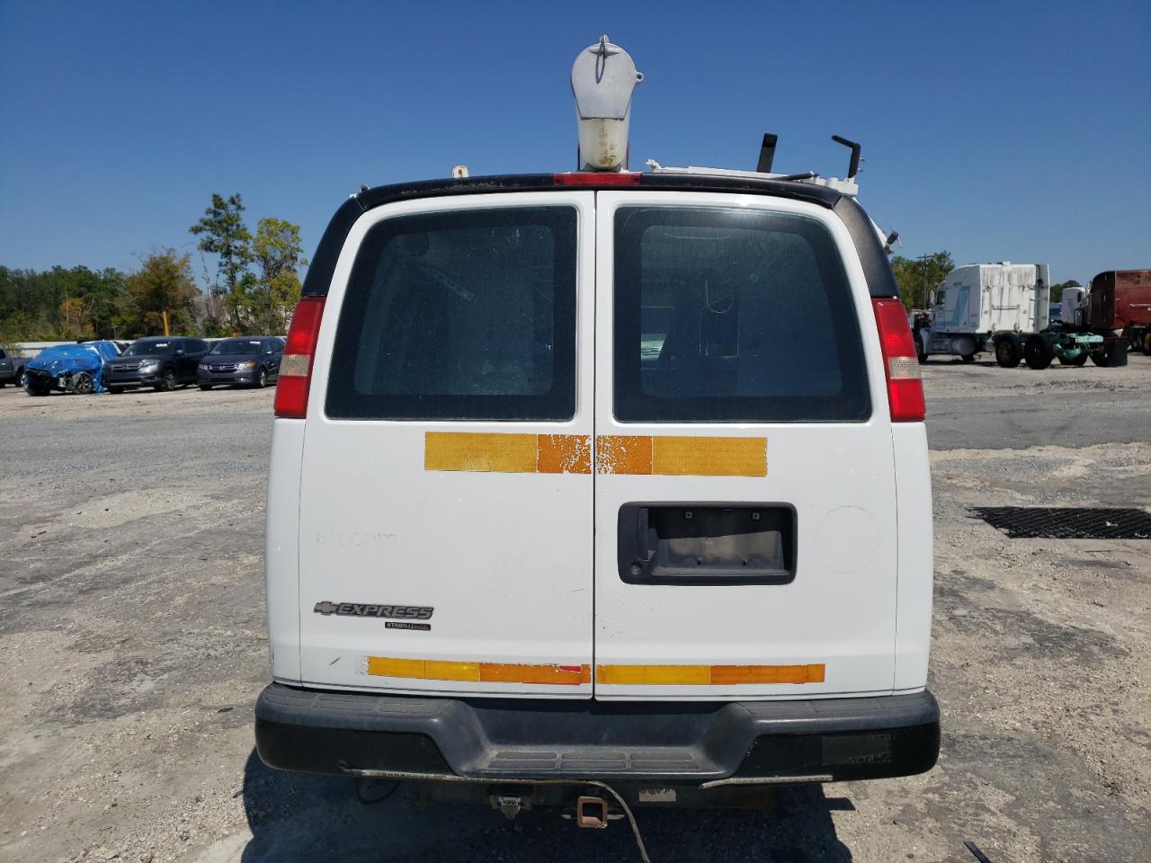 2012 Chevrolet Express VIN 1GCWGFCG6C1190497 Copart auction photo, minor dent/scratches damage thumbnail 6