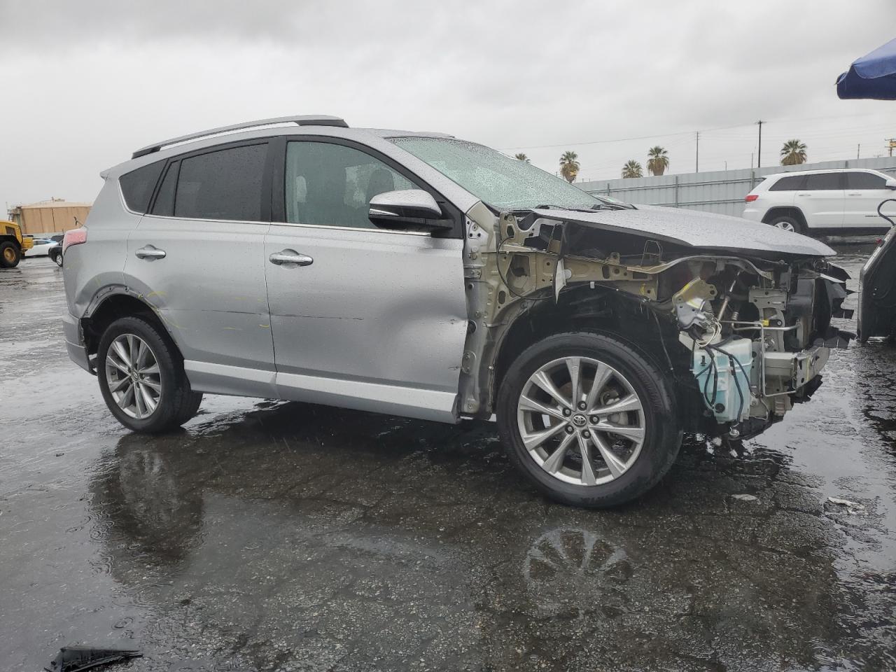 2017 Toyota RAV 4 VIN 2T3YFREV7HW360156 Copart auction photo, side / front end damage thumbnail 4