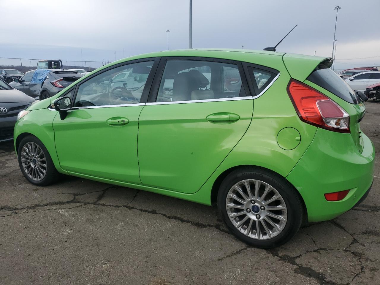 2014 Ford Fiesta VIN 3FADP4FJ4EM114016 Copart auction photo, front end / side damage thumbnail 2