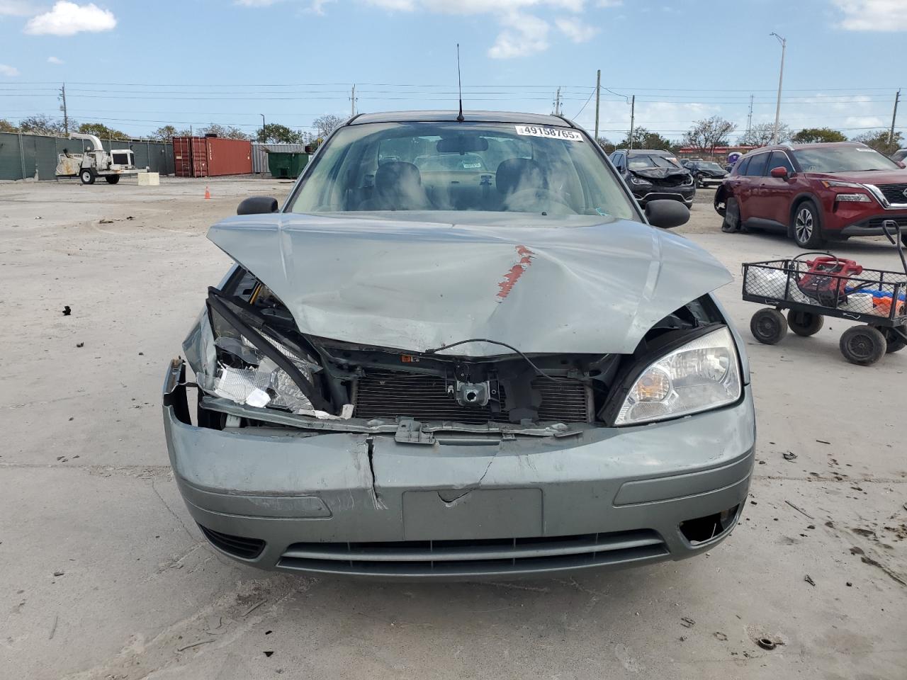 2005 Ford Focus VIN 1FAFP34NX5W304489 Copart auction photo, front end damage thumbnail 5
