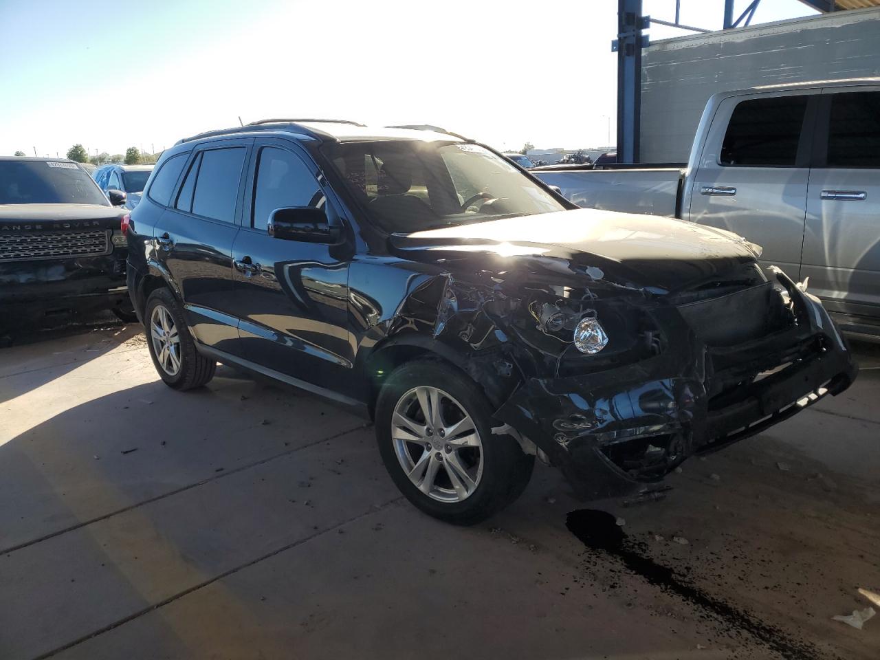 2012 Hyundai Santa Fe VIN 5XYZH4AG9CG157141 Copart auction photo, all over / front end damage thumbnail 4