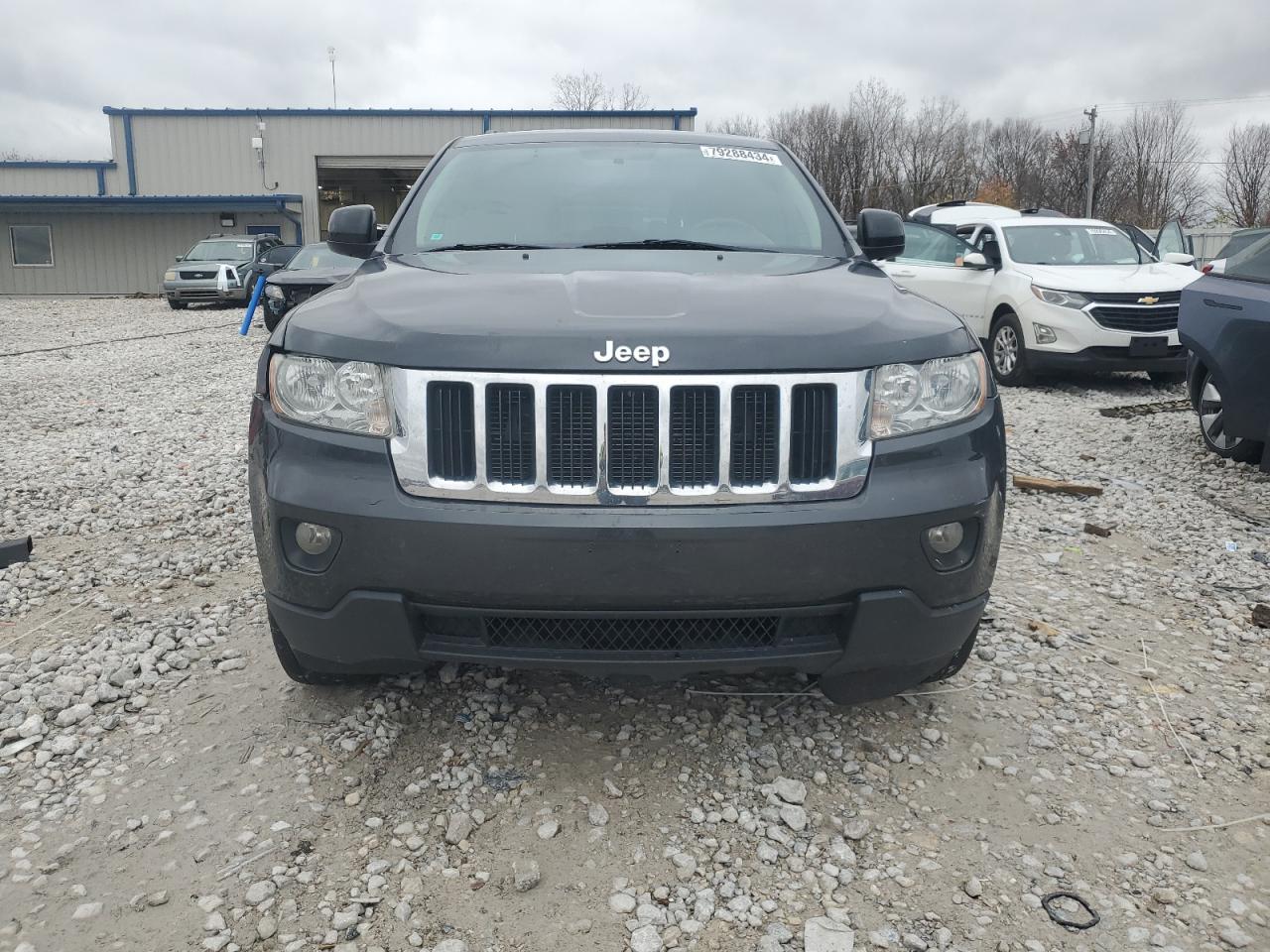 2011 Jeep Grand Cherokee VIN 1J4RR4GGXBC668780 Copart auction photo, side / front end damage thumbnail 5