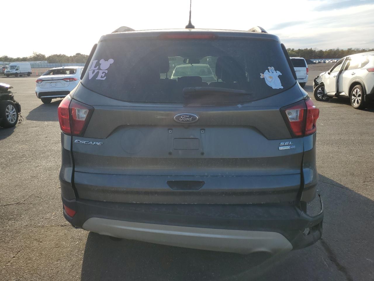 2019 Ford Escape VIN 1FMCU9HD4KUB42386 Copart auction photo, rear end / minor dent/scratches damage thumbnail 6