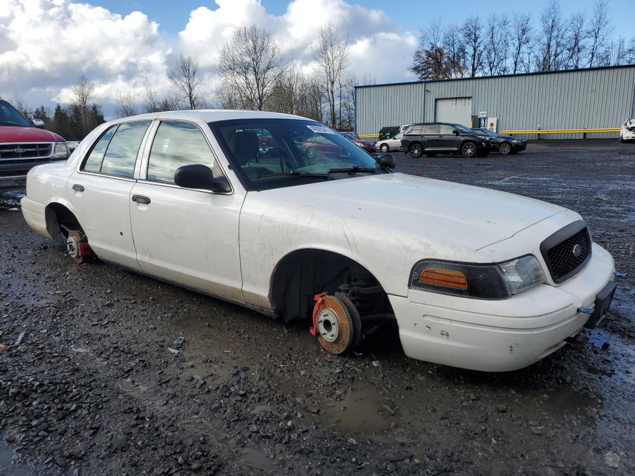 2011 Ford Crown Victoria VIN 2FABP7BVXBX157602 Copart auction photo, vandalism / stripped damage thumbnail 4