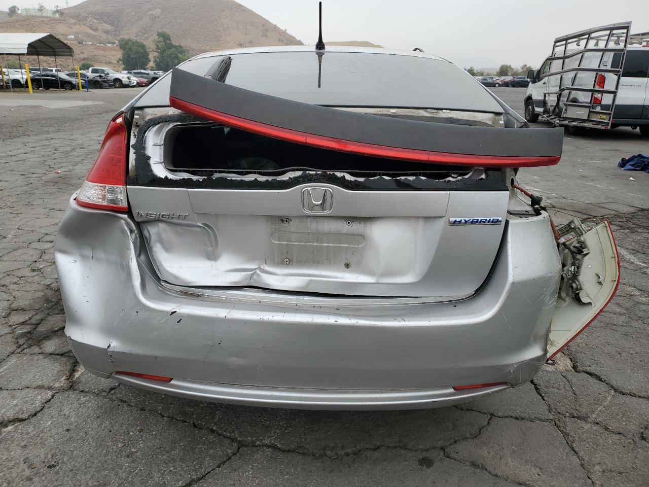 2010 Honda Insight VIN JHMZE2H56AS043184 Copart auction photo, all over damage thumbnail 6