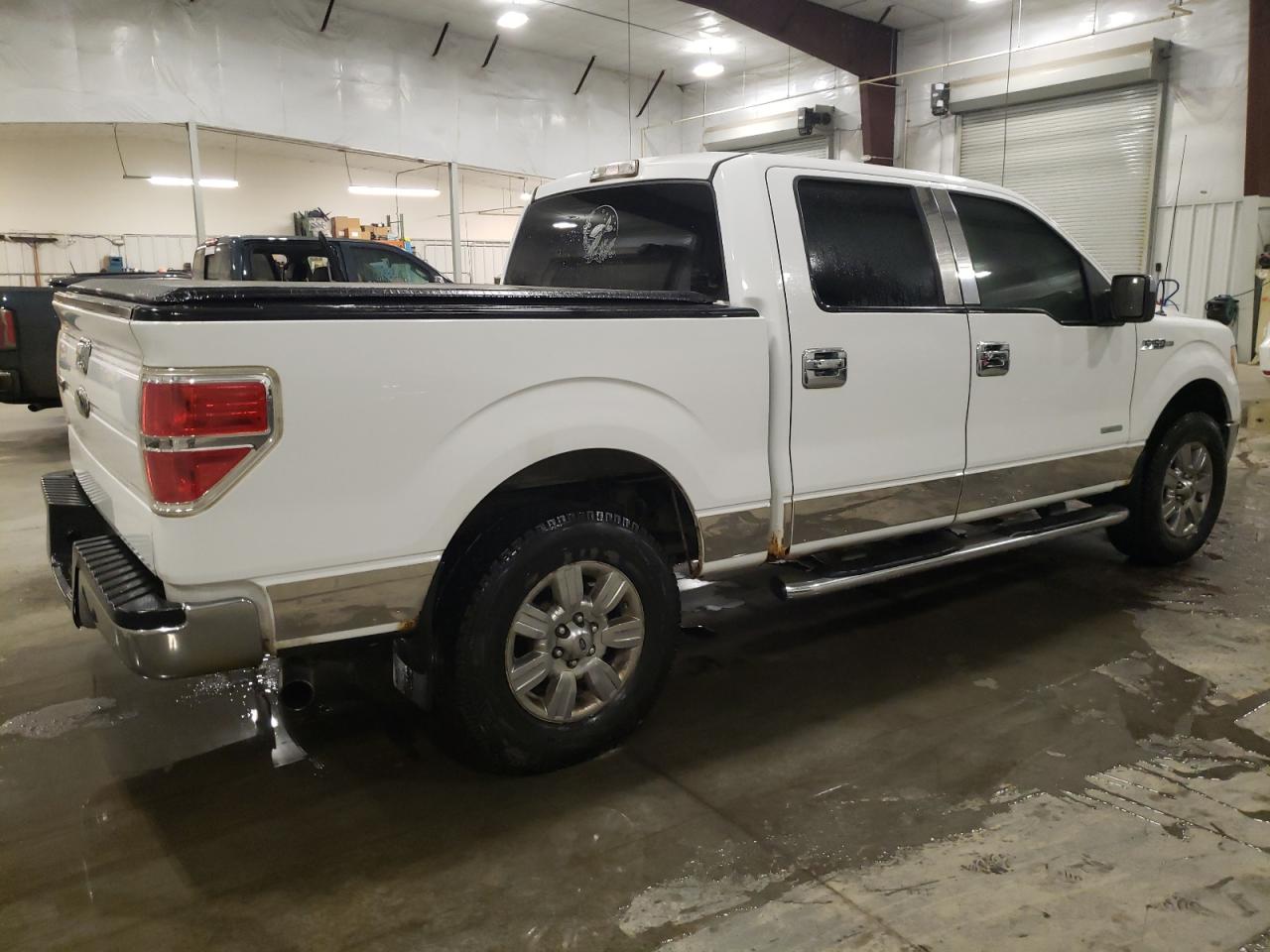 2011 Ford F-150 VIN 1FTFW1ETXBFB43815 Copart auction photo, burn - interior damage thumbnail 3