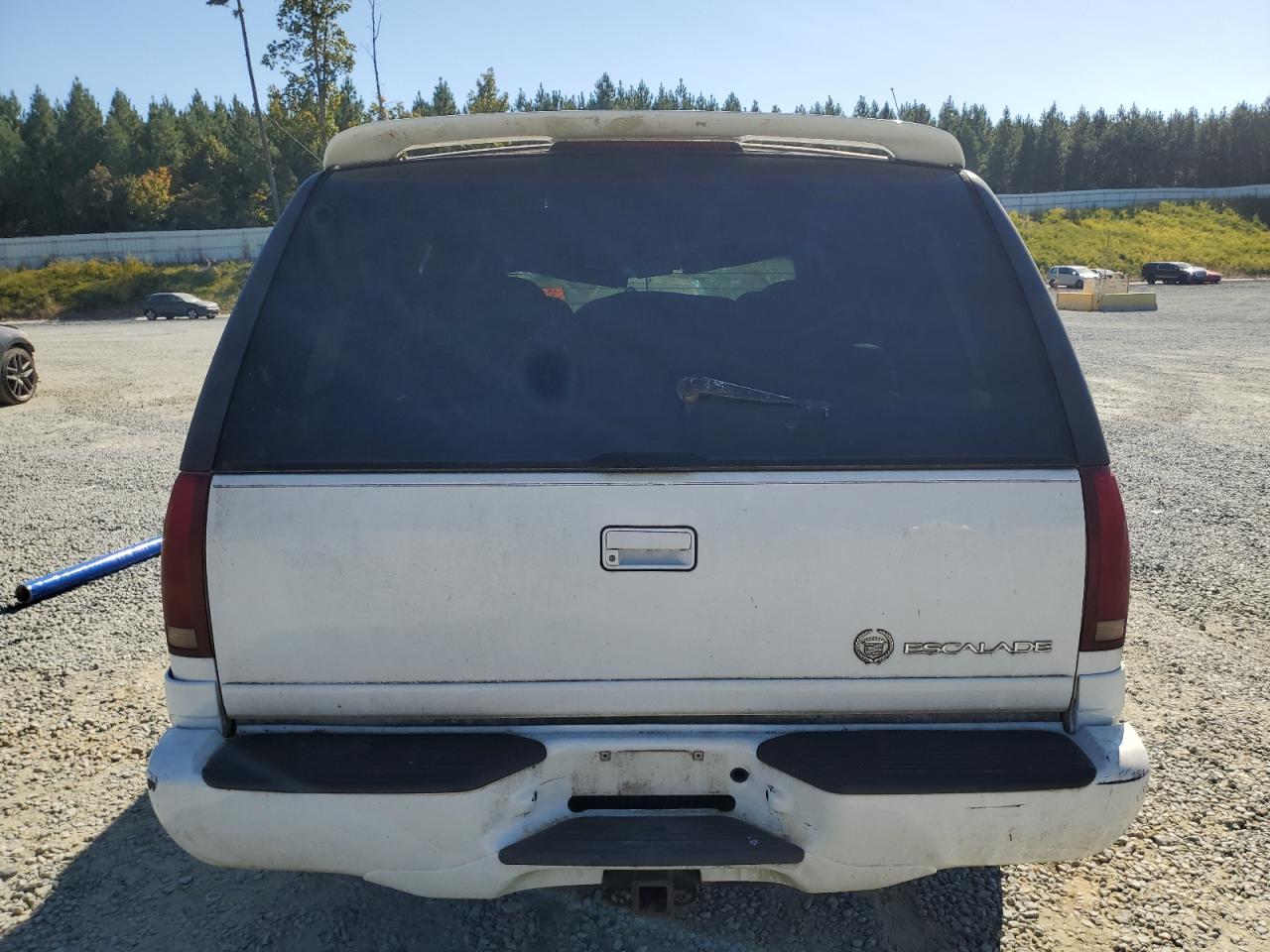1999 Cadillac Escalade VIN 1GYEK13R8XR411548 Copart auction photo, top/roof damage thumbnail 6