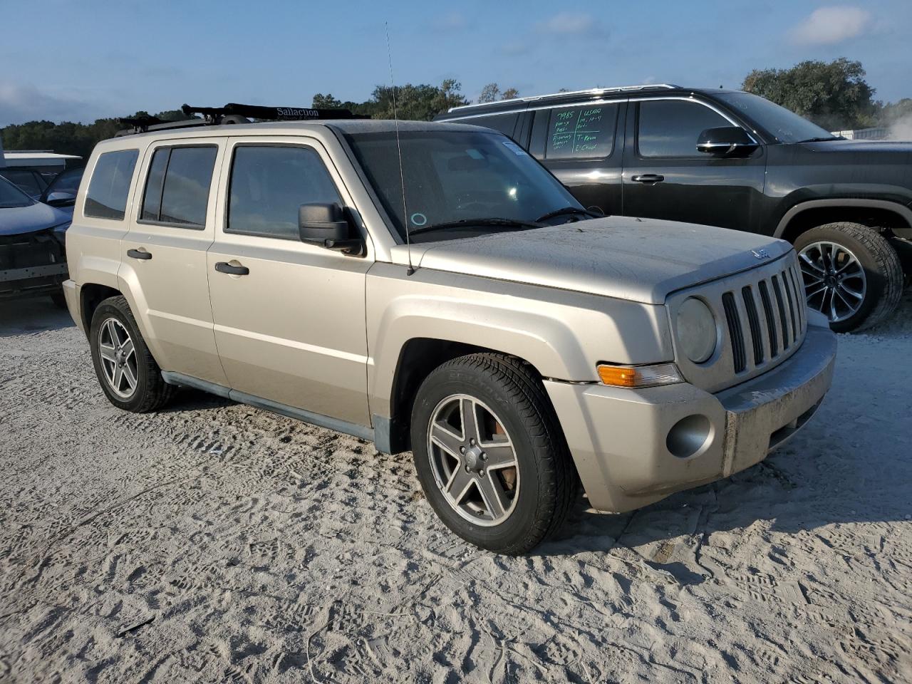2010 Jeep Liberty (Patriot) VIN 1J4NT2GB4AD503020 Copart auction photo, minor dent/scratches damage thumbnail 4