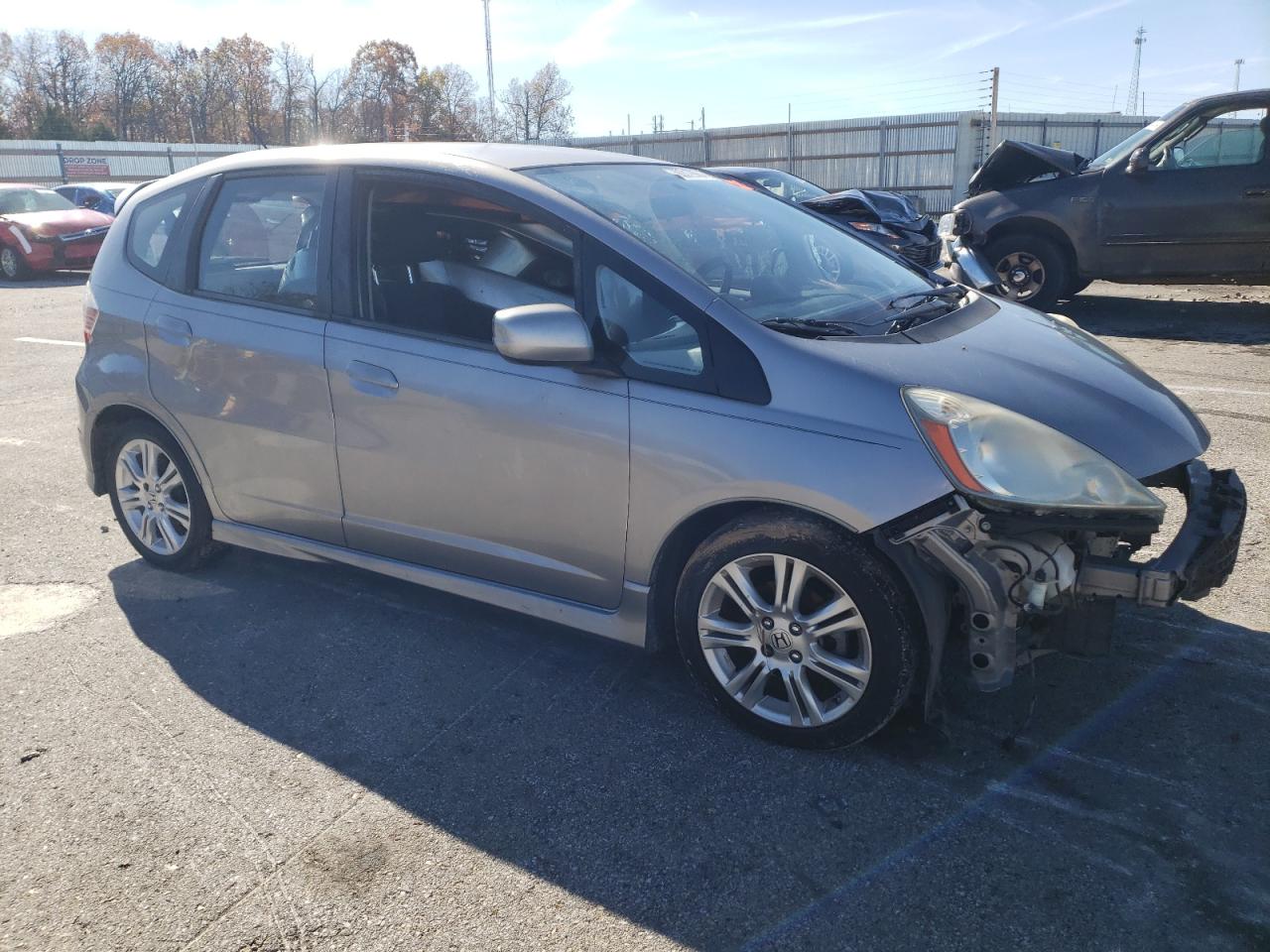 2009 Honda Fit VIN JHMGE88459S073158 Copart auction photo, front end / all over damage thumbnail 4