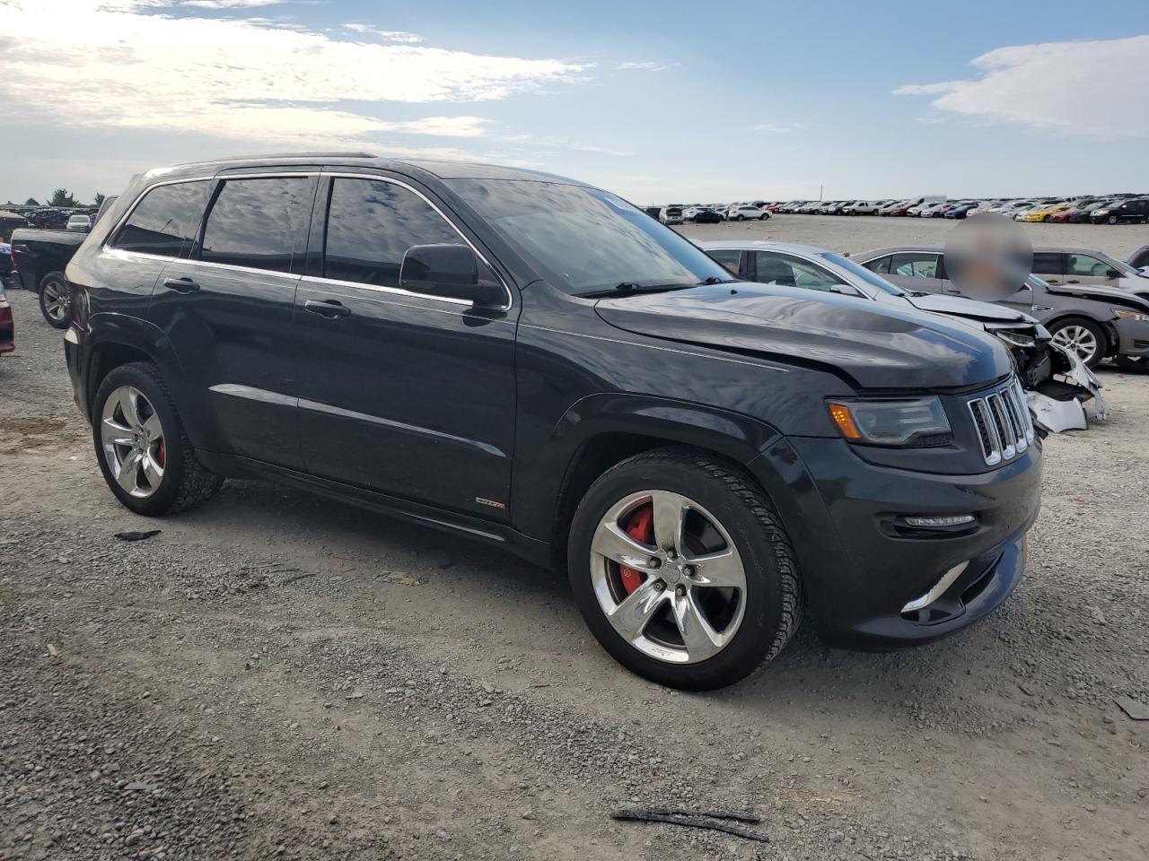 2015 Jeep Grand Cherokee VIN 1C4RJFDJ3FC639345 Copart auction photo, front end / minor dent/scratches damage thumbnail 4