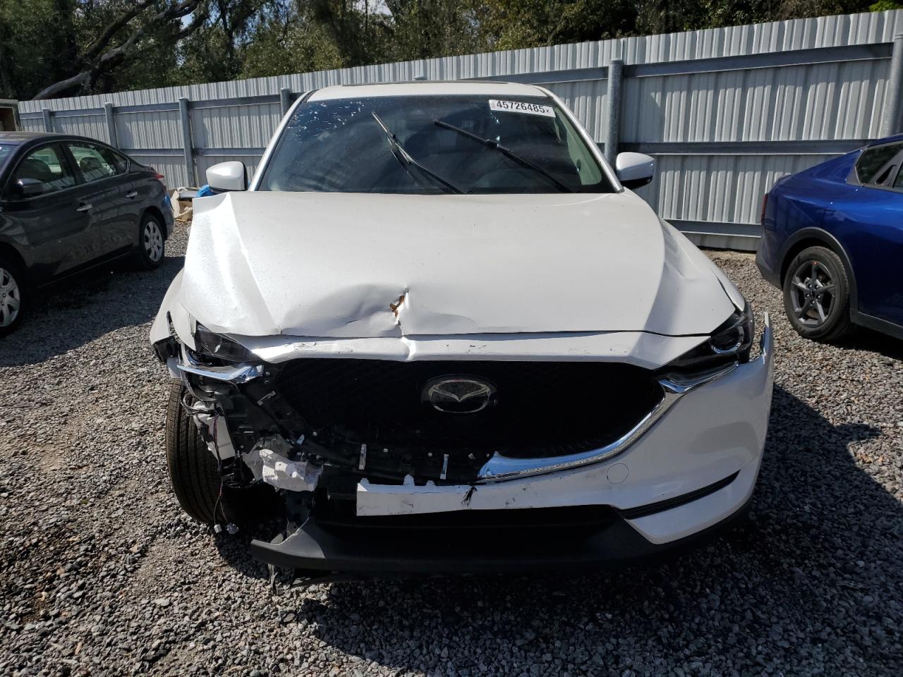 2021 Mazda CX-5 VIN JM3KFBCM3M1494718 Copart auction photo, front end / side damage thumbnail 5