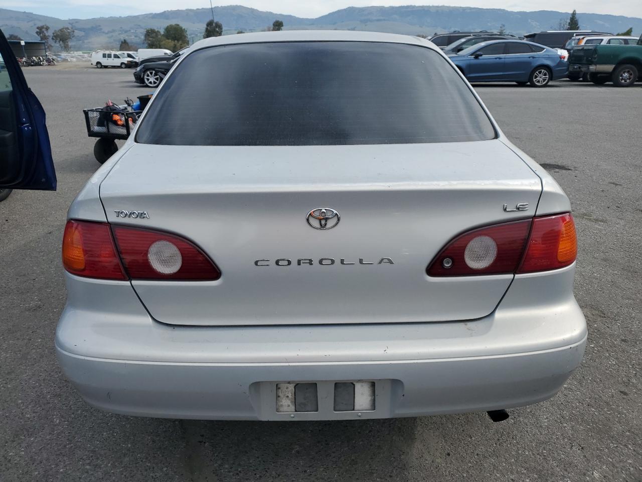 2001 Toyota Corolla VIN 1NXBR12E31Z428258 Copart auction photo, front end / side damage thumbnail 6