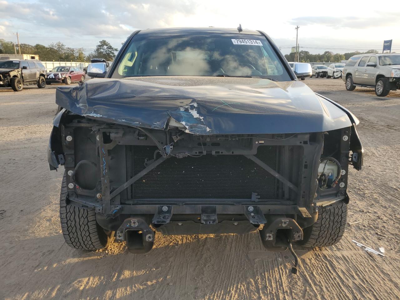 2015 Chevrolet Tahoe VIN 1GNSCCKCXFR101048 Copart auction photo, front end / side damage thumbnail 5