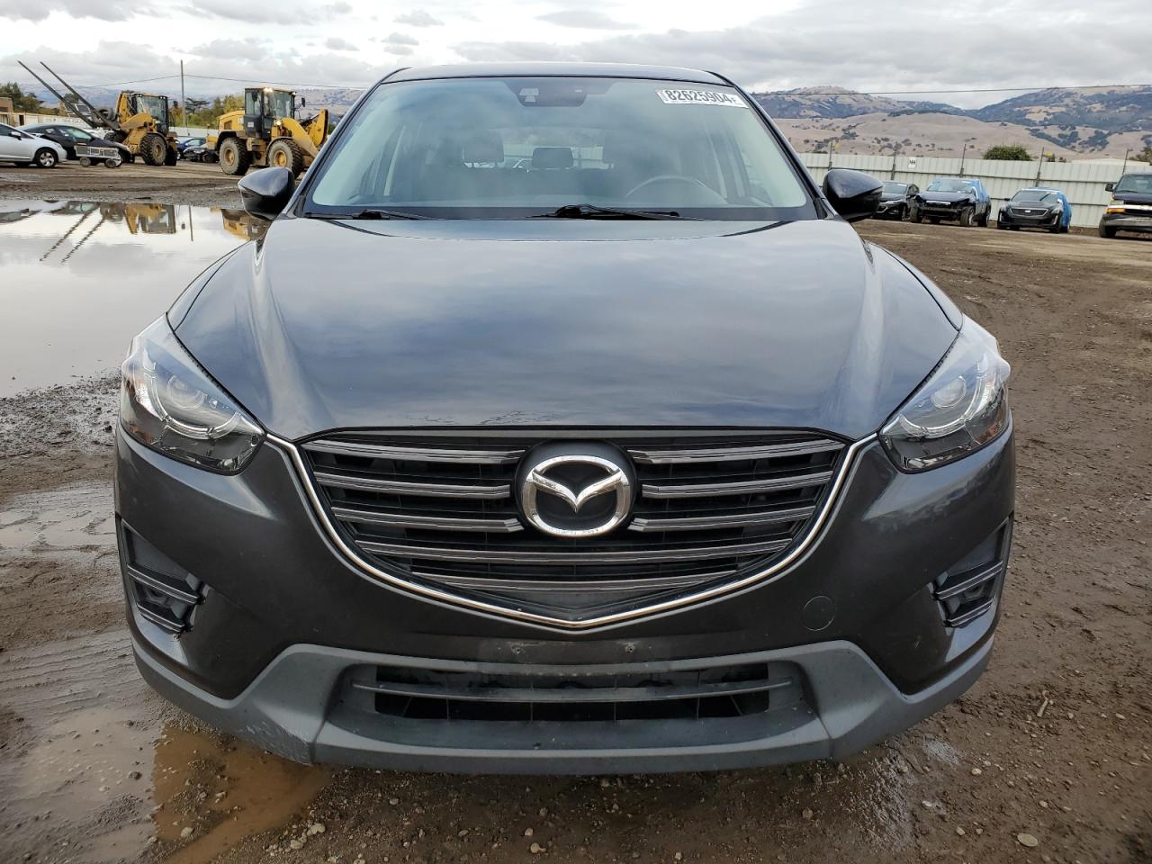 2016 Mazda CX-5 VIN JM3KE2DY3G0692441 Copart auction photo, side / undercarriage damage thumbnail 5