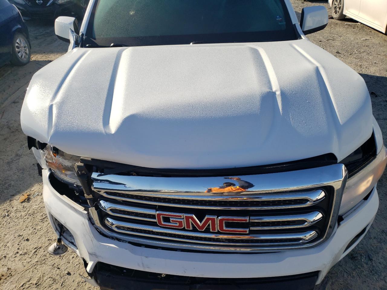 2019 GMC Canyon VIN 1GTG5CENXK1329856 Copart auction photo, all over damage thumbnail 11