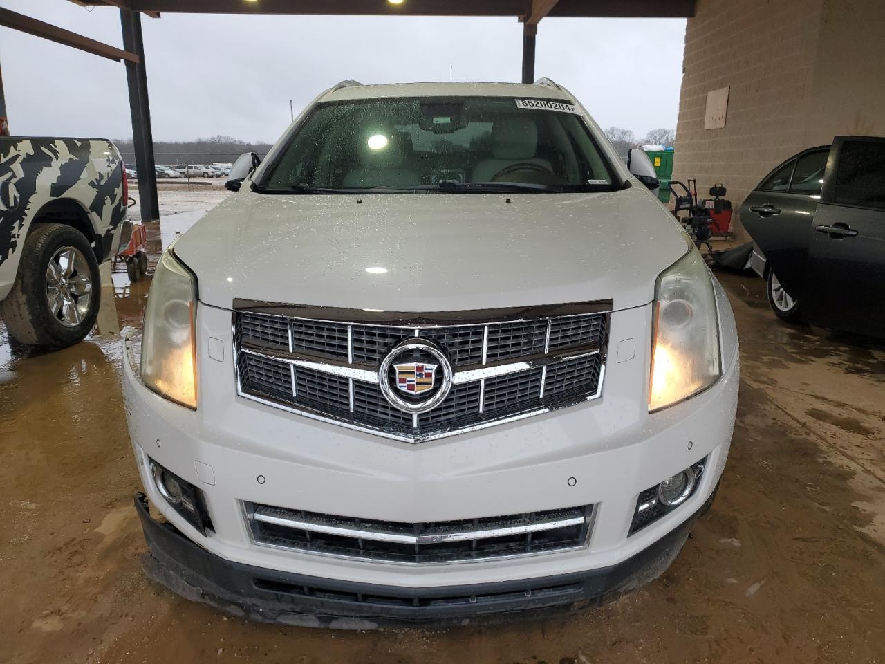 2010 Cadillac SRX VIN 3GYFNFEY9AS590572 Copart auction photo, side / front end damage thumbnail 5