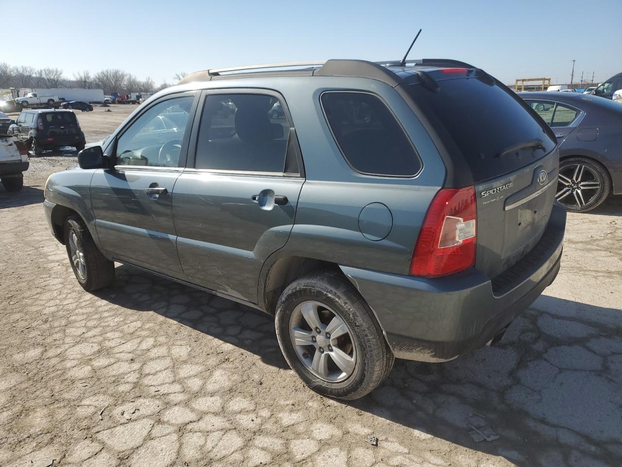 2009 KIA Sportage VIN KNDJF724497573841 Copart auction photo, vandalism damage thumbnail 2