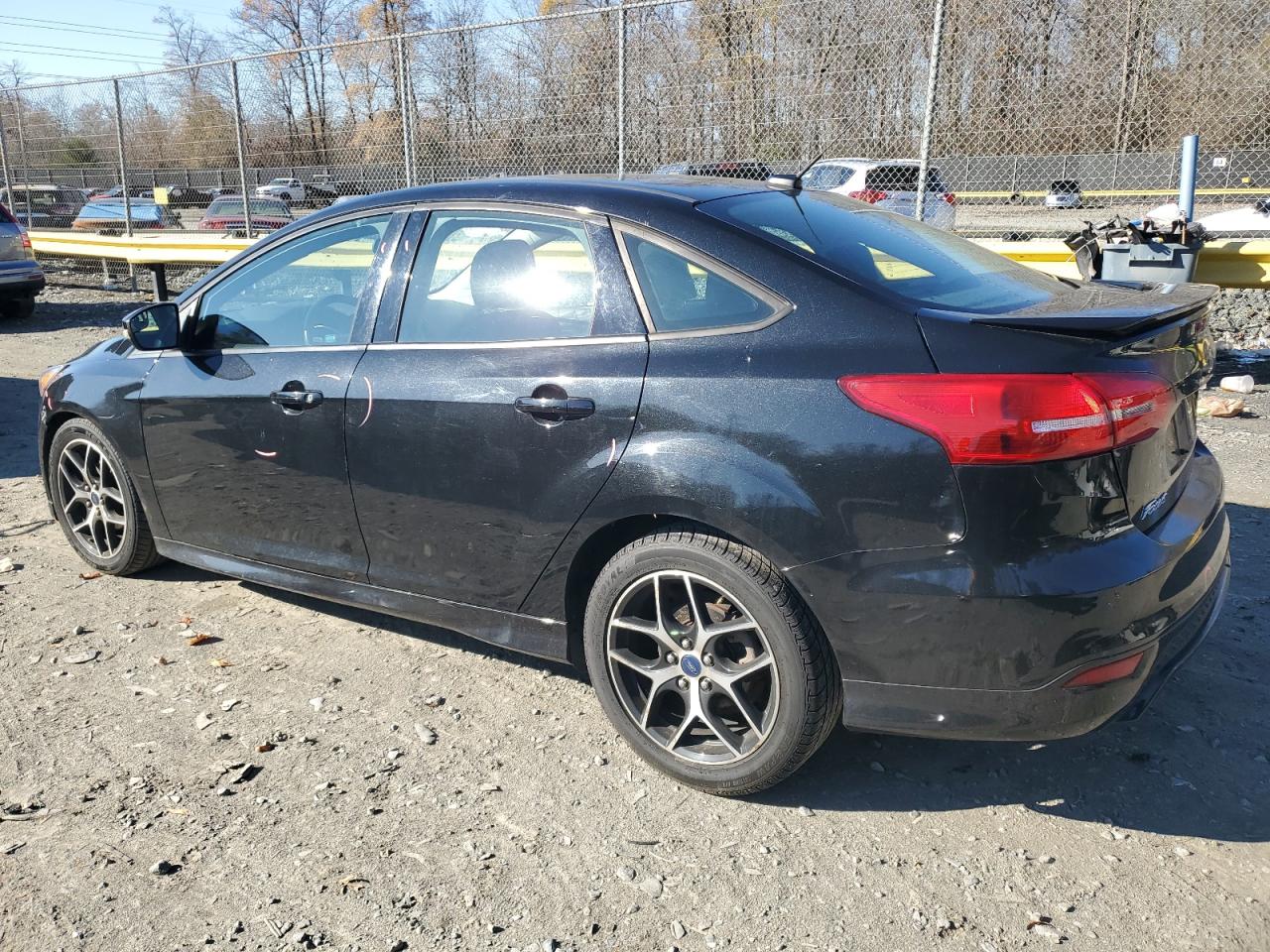 2015 Ford Focus VIN 1FADP3F29FL297662 Copart auction photo, side / minor dent/scratches damage thumbnail 2