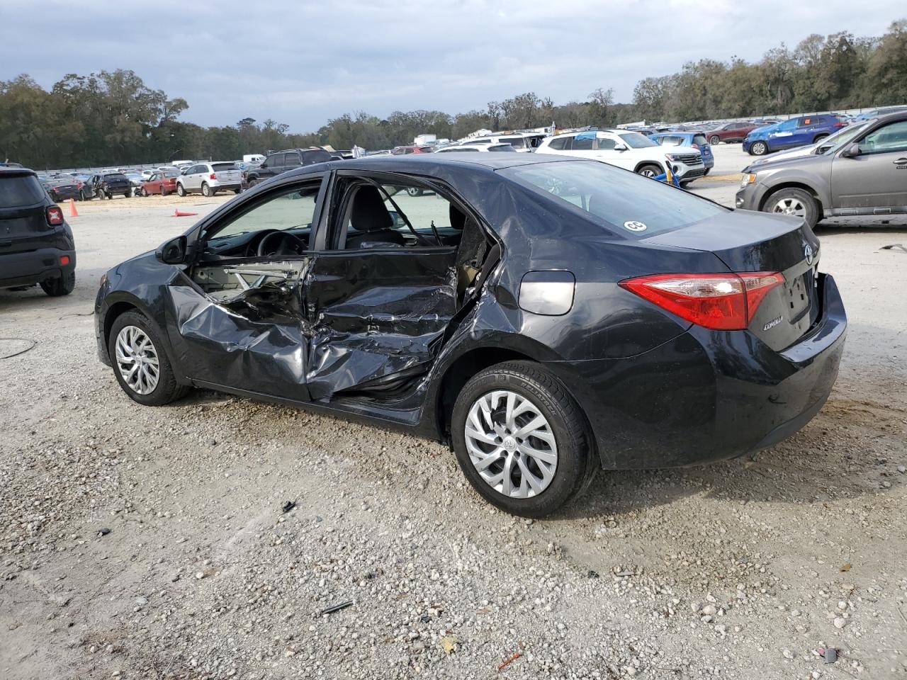 2018 Toyota Corolla VIN 5YFBURHE4JP792517 Copart auction photo, side / all over damage thumbnail 2