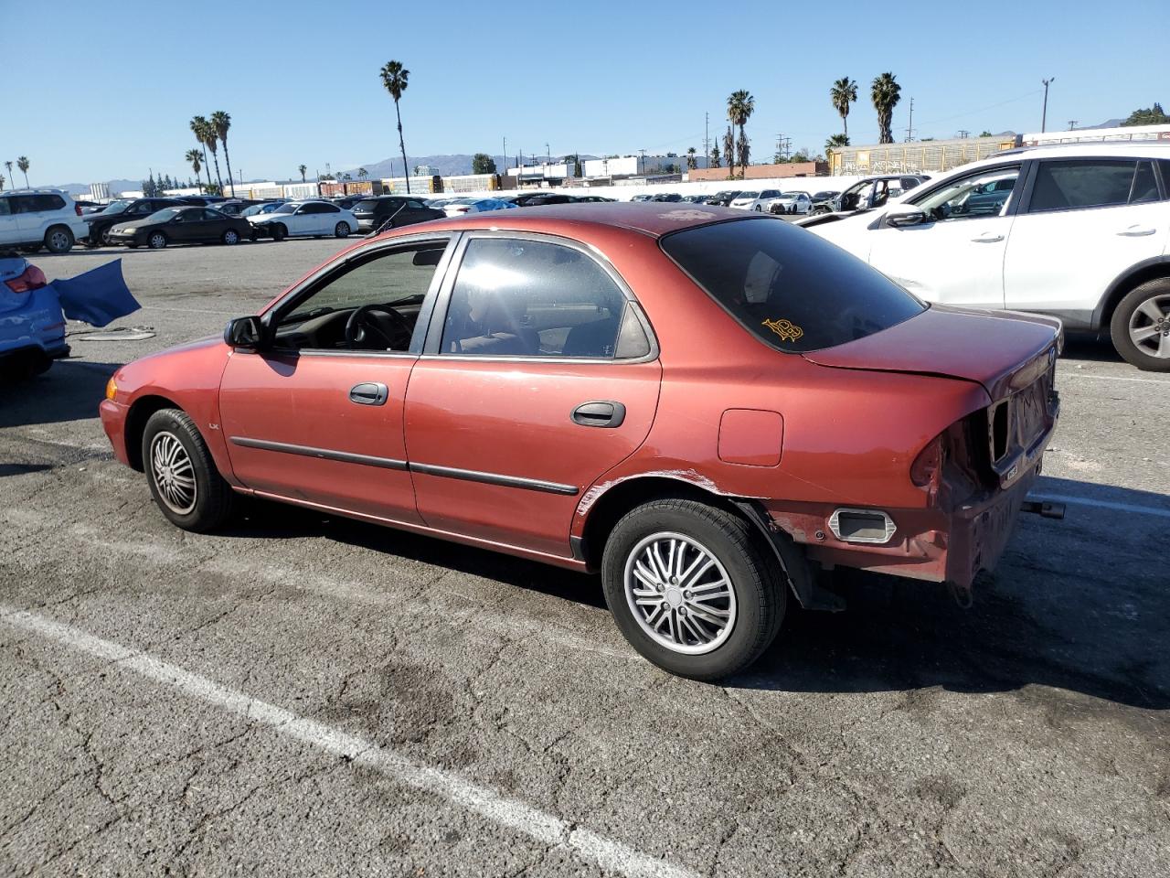 1998 Mazda Protege VIN JM1BC1411W0198007 Copart auction photo, rear end / minor dent/scratches damage thumbnail 2