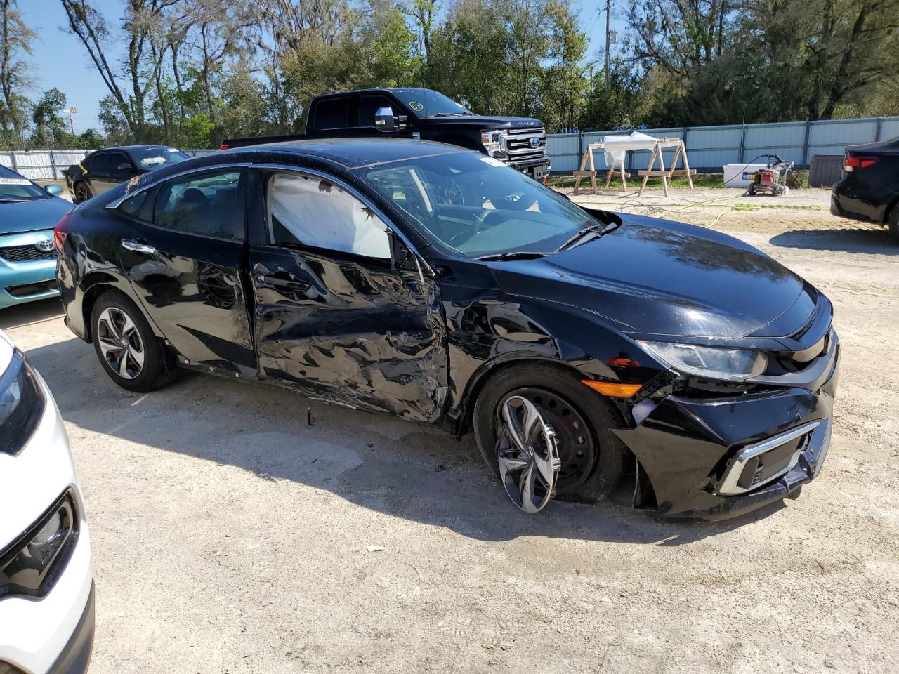 2019 Honda Civic VIN 19XFC2F67KE045391 Copart auction photo, side / front end damage thumbnail 4