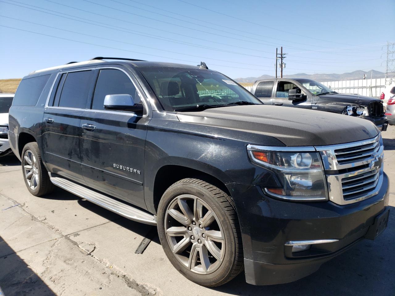 2015 Chevrolet Suburban VIN 1GNSKKKC5FR500768 Copart auction photo, hail / minor dent/scratches damage thumbnail 4
