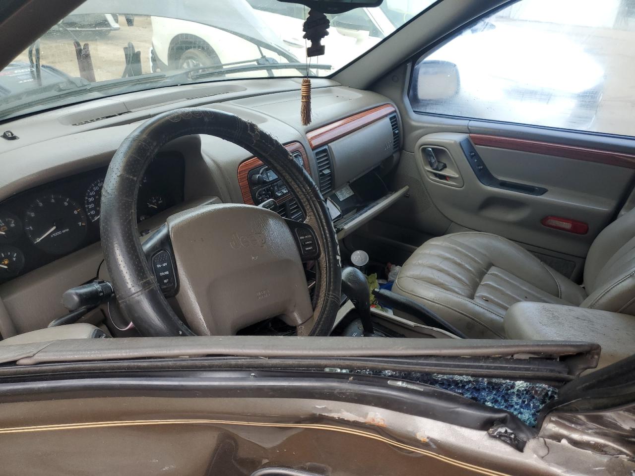 1999 Jeep Grand Cherokee VIN 1J4G268S3XC728805 Copart auction photo, side damage thumbnail 7