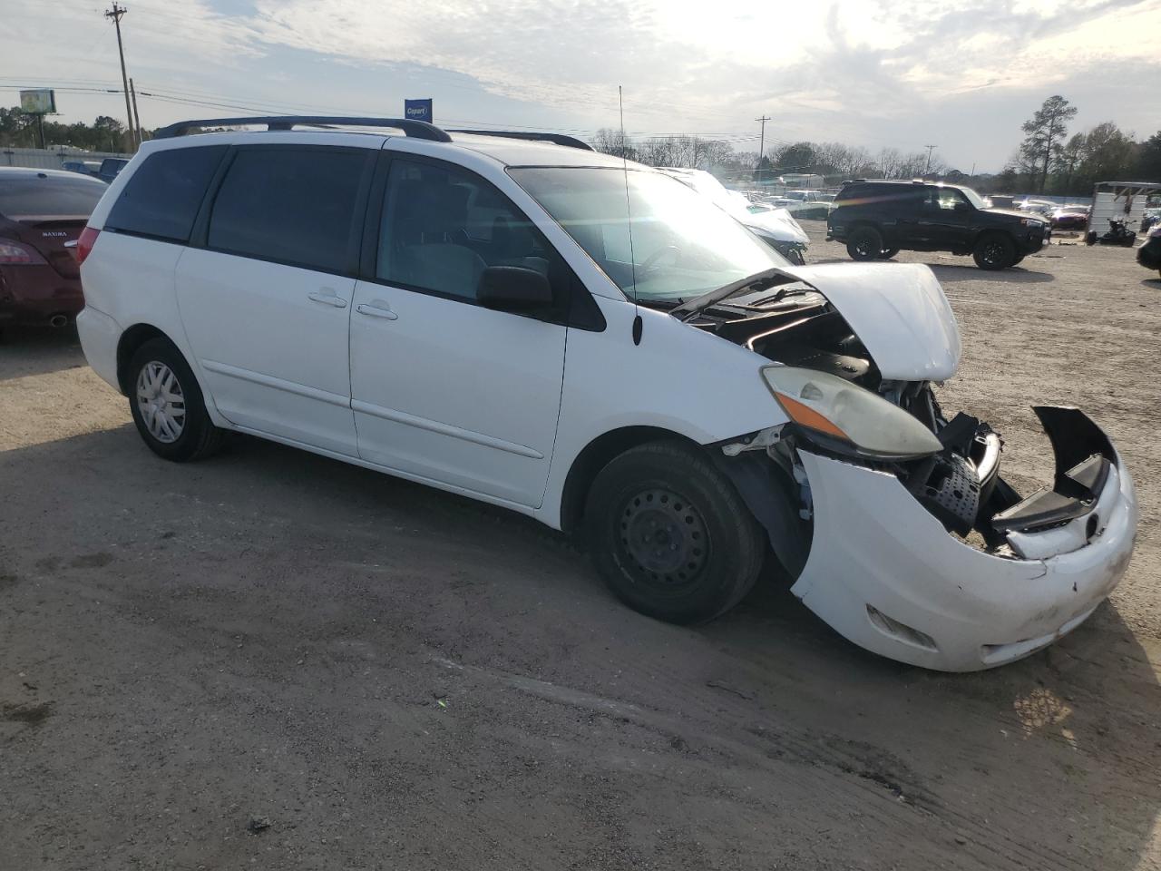 2010 Toyota Sienna VIN 5TDKK4CC4AS340444 Copart auction photo, front end / all over damage thumbnail 4