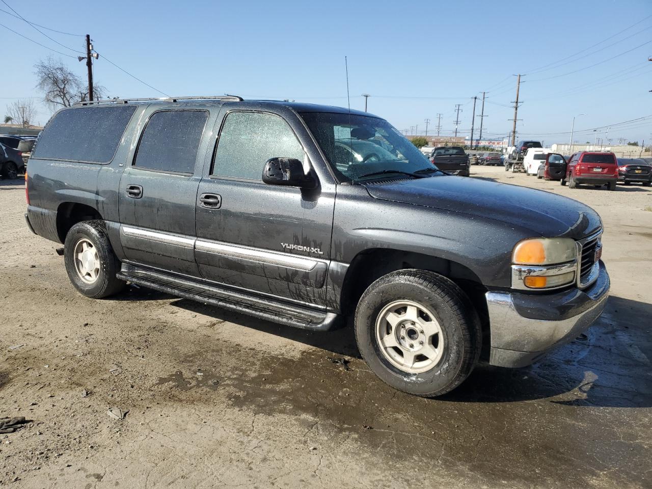 2003 GMC Yukon VIN 1GKEC16T43J329372 Copart auction photo, side / front end damage thumbnail 4