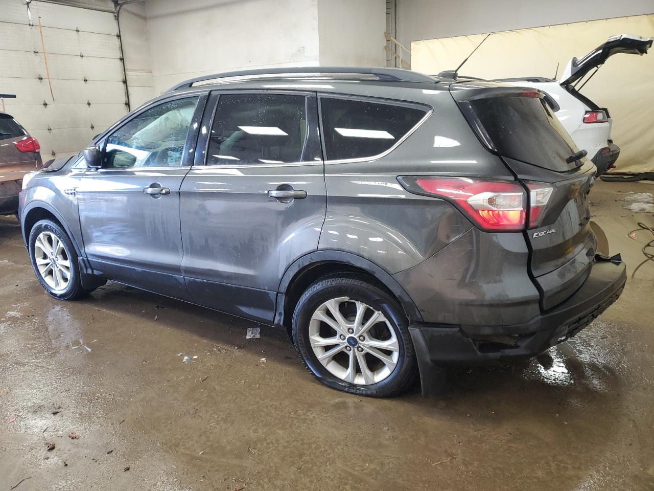 2017 Ford Escape VIN 1FMCU9G93HUA30670 Copart auction photo, all over damage thumbnail 2