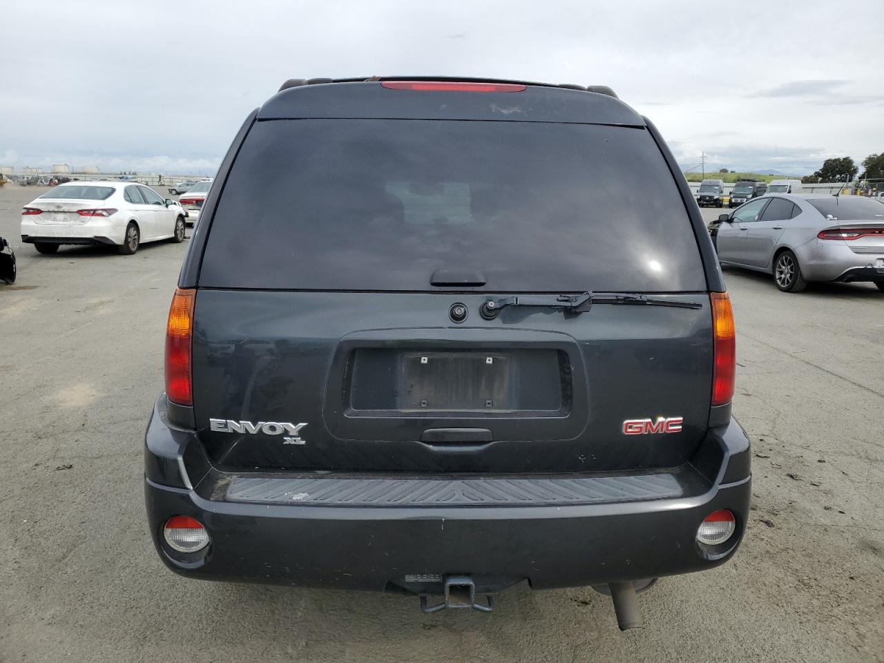 2004 GMC Envoy VIN 1GKES16S546100410 Copart auction photo, side / rear end damage thumbnail 6