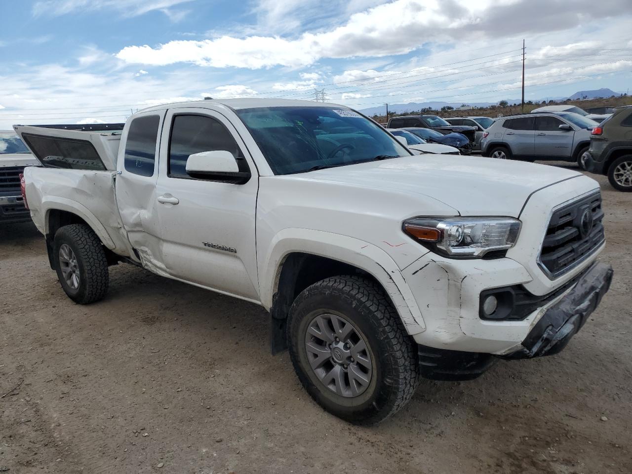 2018 Toyota Tacoma VIN 5TFSZ5AN0JX165044 Copart auction photo, side / front end damage thumbnail 4