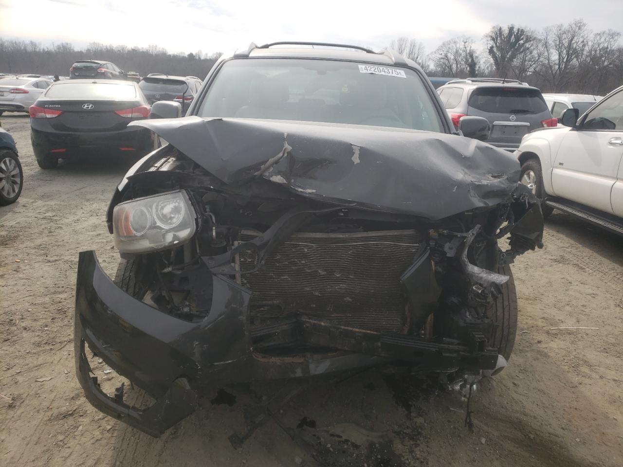 2012 Hyundai Santa Fe VIN 5XYZKDAG8CG095880 Copart auction photo, all over damage thumbnail 5