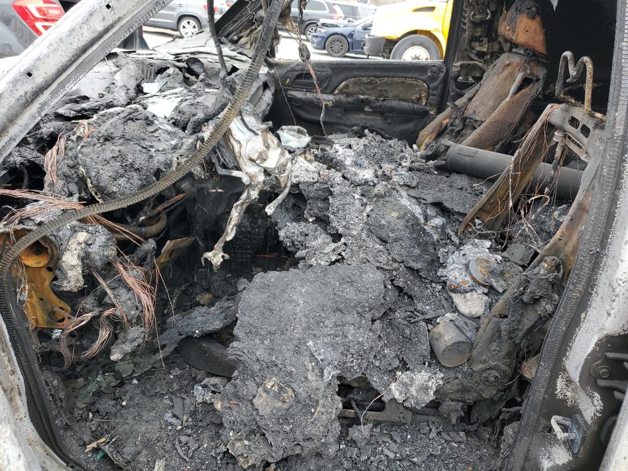 2012 Chevrolet Suburban VIN 1GNSKJE79CR315756 Copart auction photo, burn damage thumbnail 7