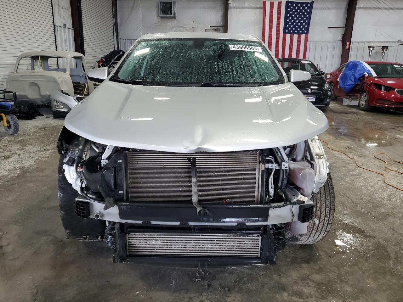 2018 Chevrolet Equinox VIN 2GNAXSEV7J6281682 Copart auction photo, front end / side damage thumbnail 5