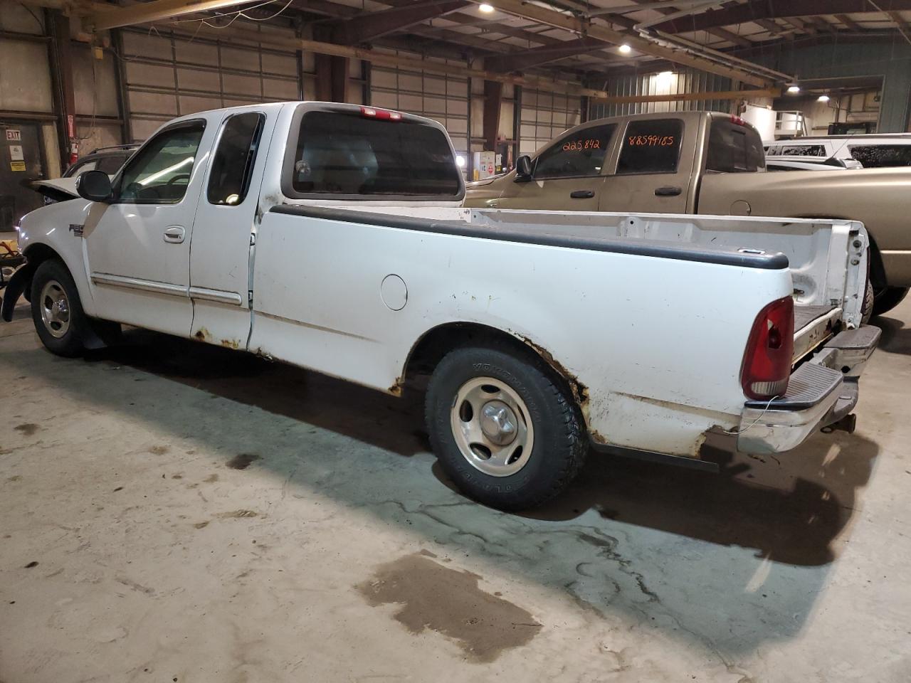 1999 Ford F-150 VIN 2FTRX17W4XCB10247 Copart auction photo, front end / rear end damage thumbnail 2