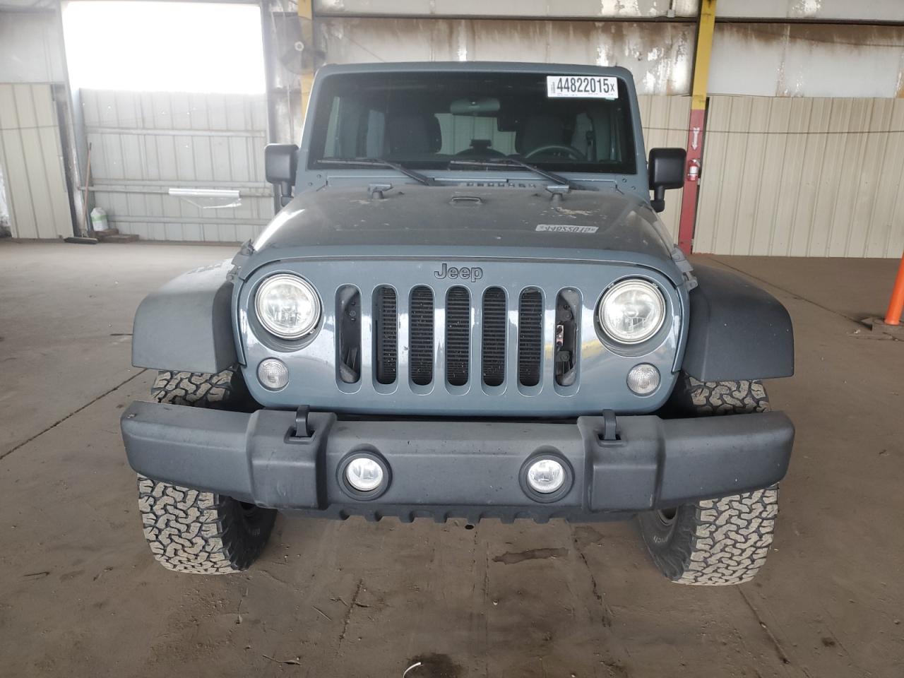 2015 Jeep Wrangler VIN 1C4BJWDG5FL693042 Copart auction photo, side damage thumbnail 5