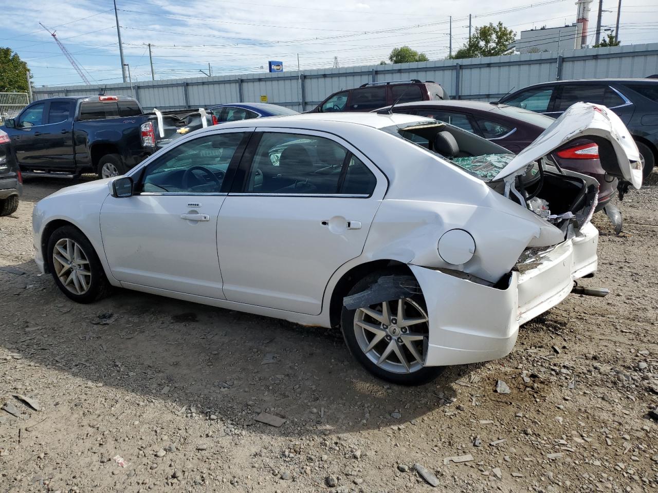 2012 Ford Fusion VIN 3FAHP0JA9CR143111 Copart auction photo, rear end damage thumbnail 2