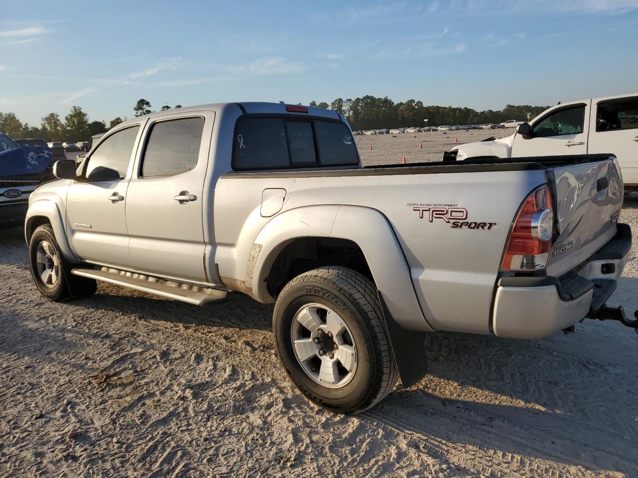 2010 Toyota Tacoma VIN 3TMKU4HN7AM026100 Copart auction photo, side damage thumbnail 2
